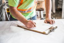 Misc. Businesses Stock photo of worker with clipboard