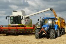 Stock photo of a combine and tractor Combine and tractor